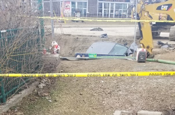 An SUV ended up in the pit at the site of the watermain break at the corner of Big Bay Point and Yonge Street on Saturday, April 6. Shawn Gibson/BarrieToday