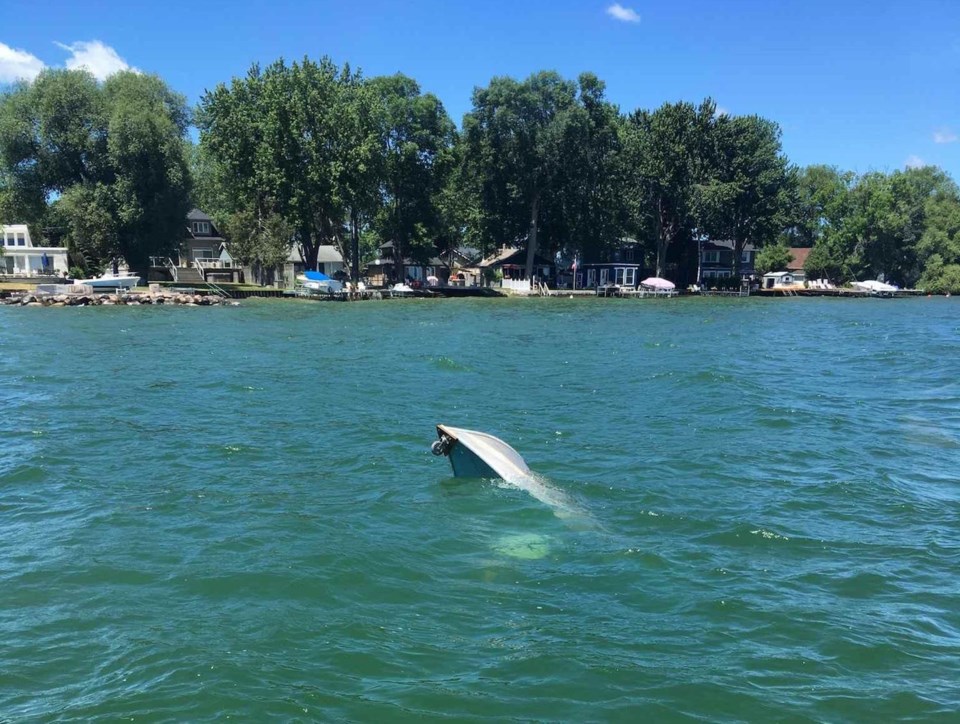 Capsized boat Cook's Bay rescue