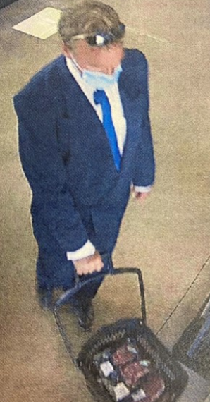 Police are searching for this well-dressed man who walked out of Goodness Me Sunday without paying for a basket full of goods.