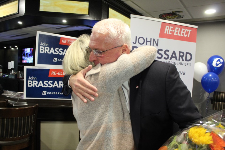 John Brassard shares a hug with his wife, Liane, after giving his victory speech Monday, Oct. 21, 2019 at the BMC. Raymond Bowe/BarrieToday