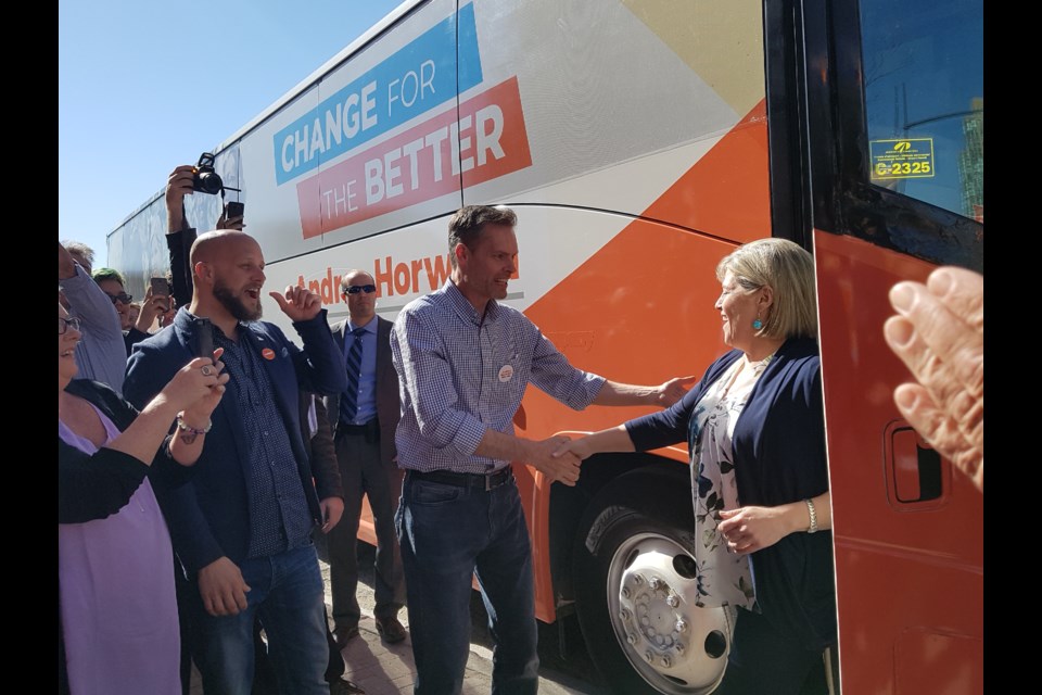 Barrie-Innisfil NDP candidate Pekka Reinio, with fellow local candidate Dan Janssen to his right, greets party leader Andrea Horwath as she arrives in downtown Barrie, Saturday. Shawn Gibson for BarrieToday