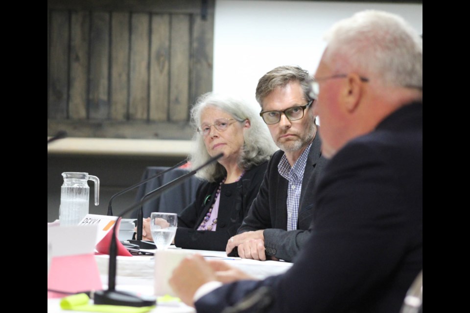 The NDP's Pekka Reinio listens to Conservative candidate John Brassard answer a question during CARP's candidates debate on Wednesday, Oct. 2, 2019 at the Sheba Shrine Centre for the Barrie-Innisfil riding. Raymond Bowe/BarrieToday