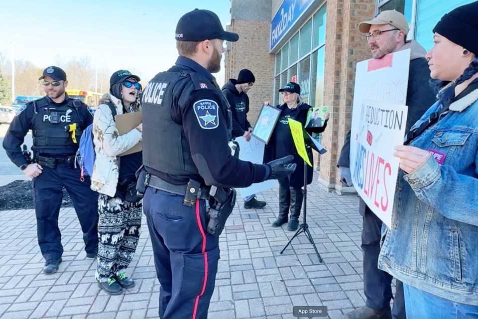 Barrie police break up a small group of peaceful protesters standing outside Barrie-Innisfil MPP Andrea Khanjin’s constituency office on Mapleview Drive in south-end Barrie, Thursday morning.
The rally was aimed at saving Ontario’s supervised consumption sites (SCSs). Khanjin's office was closed at the time.