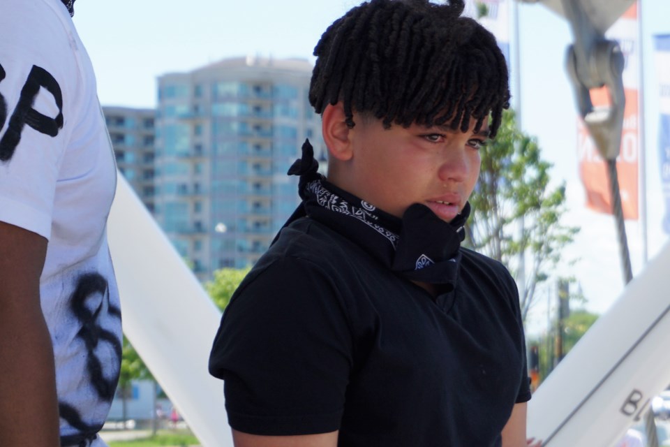 T.J. Hawksworth, 10, son of Terrell Parris, weeps while his father shared his fears during a Black Lives Matter Protest in Barrie on June 6, 2020. Jessica Owen/BarrieToday  