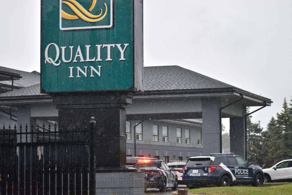 There was a heavy police presence at the Quality Inn on Hart Drive in Barrie this morning after a disagreement between a man and woman led to him being seriously injured and her on the run.