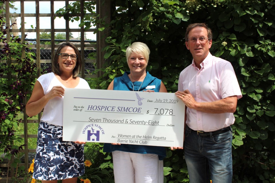 The Barrie Yacht Club's 16th annual Barrie Ford Women at the Helm Regatta recently raised $7,078 for Hospice Simcoe, From left are yacht club member Carol MacDonell, Hospice Simcoe executive director Kelly Hubbard, and club member Dr. Brian Morris, who is also medical director at Hospice Simcoe. Photo supplied