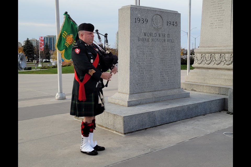 Grey and Simcoe Foresters regimental bagpiper Scott Buchanan played by the Barrie cenotaph, Thursday, Nov. 11.