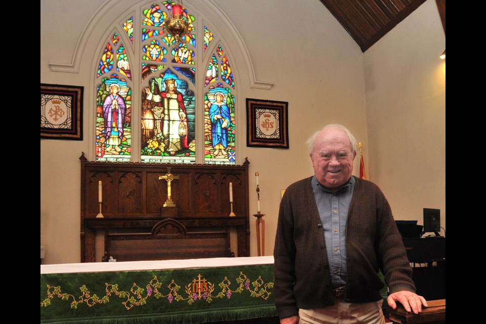 George Timpson, deputy rector's warden at St. Paul's Anglican Church, poses near one of the building's beautiful stained glass windows at the south-end Barrie church. The church community has had an ongoing presence at the corner of what is now Mapleview Drive and Yonge Street since 1851. Ian McInroy for BarrieToday