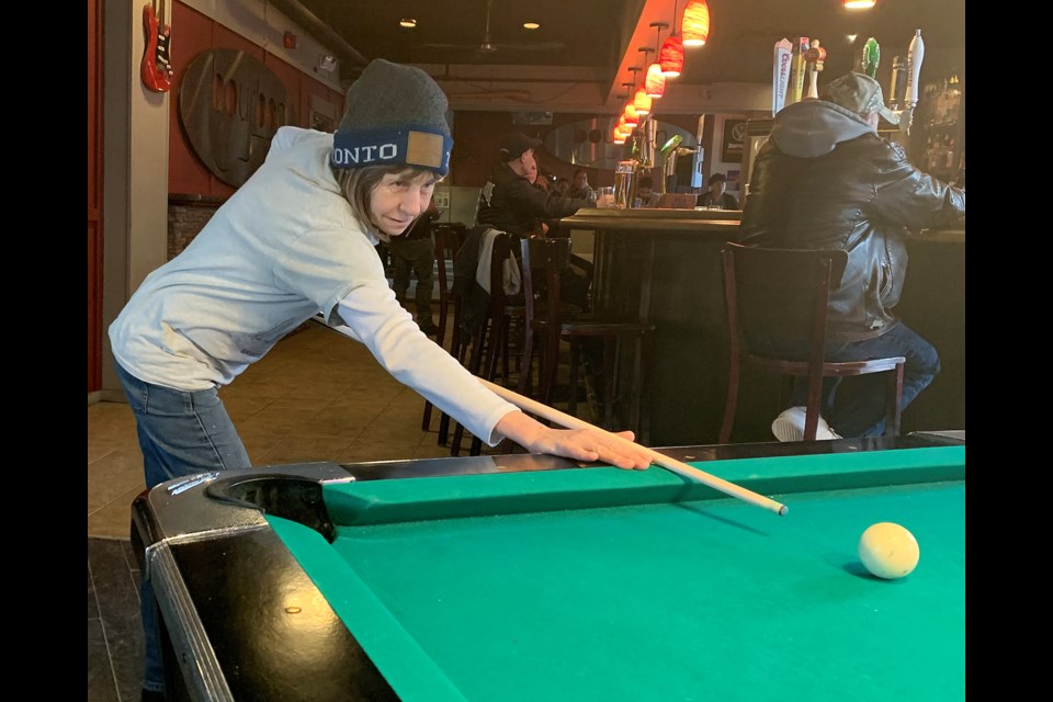Simcoe Hotel regular and former employee Bonny Greer shoots a game of pool in the downtown landmark. The establishment is now known as Bourbon. Ian McInroy for BarrieToday