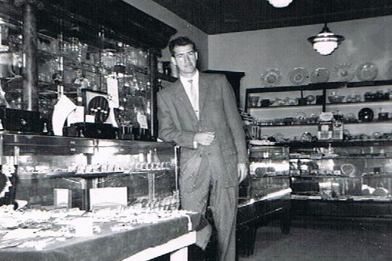 Spanking new business owner, Bill Le Boeuf, 31, stands ready for customers in 1959.