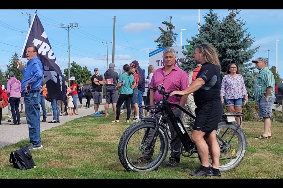 Protesters stood by Georgian Drive outside Barrie's Royal Victoria Regional Health Centre on Monday.