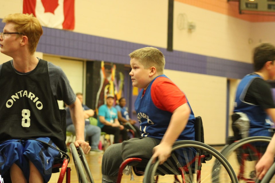 Travis Topping takes part in wheelchair basketball competition as part of the Ontario Winter Games, Friday at St. Peter's Catholic Secondary School in south-end Barrie. Raymond Bowe/BarrieToday
