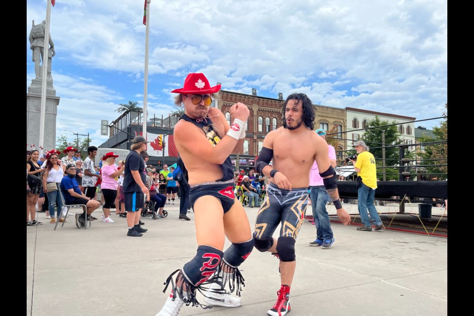 Pretty Ricky (foreground) and Puf are exhausted after a stunning defeat at Barrie Wrestling's Canada Day show at Meridian Place in downtown Barrie on Friday. More action is scheduled for Saturday beginning at noon.