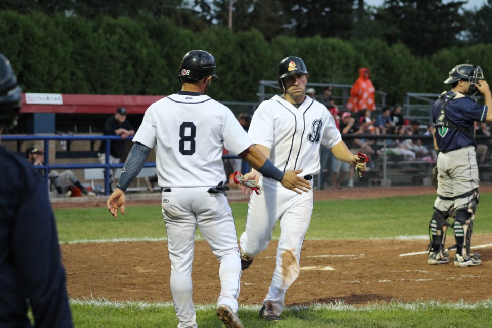 Ryan Spataro scores a run and is met at the plate by teammate Branfy Infante in Game 3 of the IBL semifinal against the Welland Jackfish, on Tuesday, Aug. 20, 2019. Raymond Bowe/BarrieToday