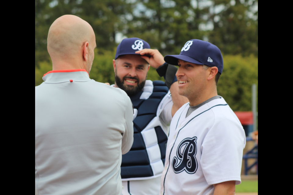 ESPN's Dan Shulman chats with veteran Barrie Baycats Kyle DeGrace (middle) and Ryan Spataro (right) before throwing out the ceremonial first pitch in this file photo from 2019. Spataro has announced his retirement after 15 stellar seasons.