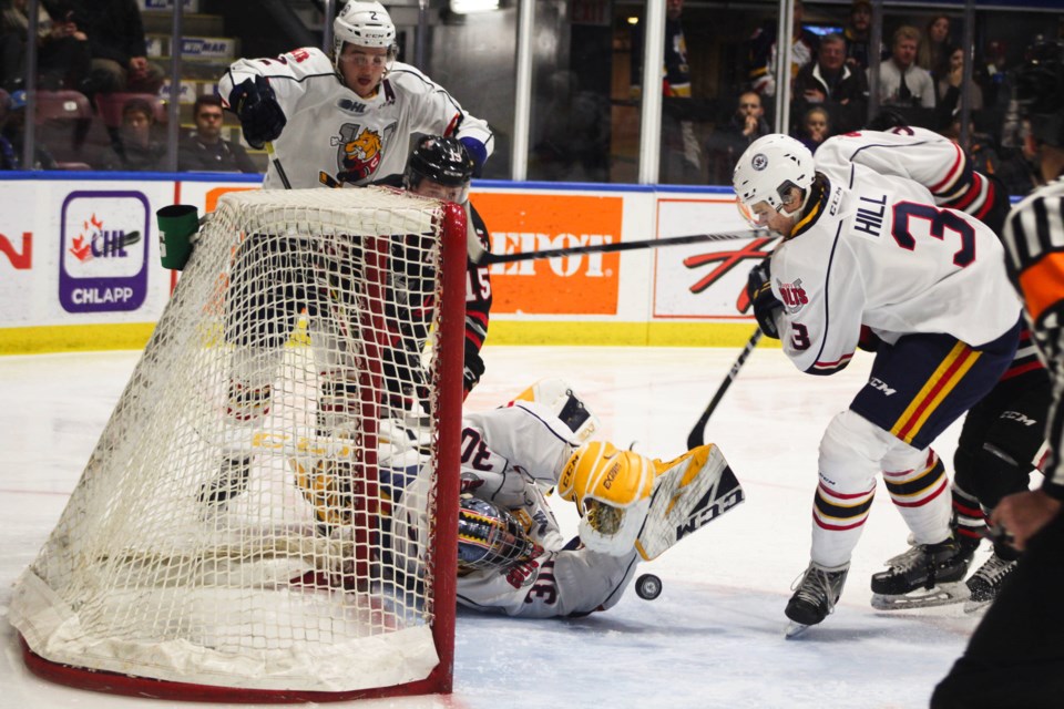 Barrie Colts defenceman Mathew Hill scrambles to clear a loose puck from in front of goaltender Arturs Silovs during OHL action against the Niagara IceDogs on Saturday, Nov. 23, 2019 at the BMC. Raymond Bowe/BarrieToday