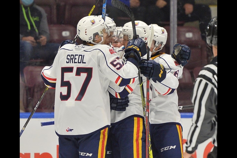 Members of the Barrie Colts celebrate a goal in this file photo.
