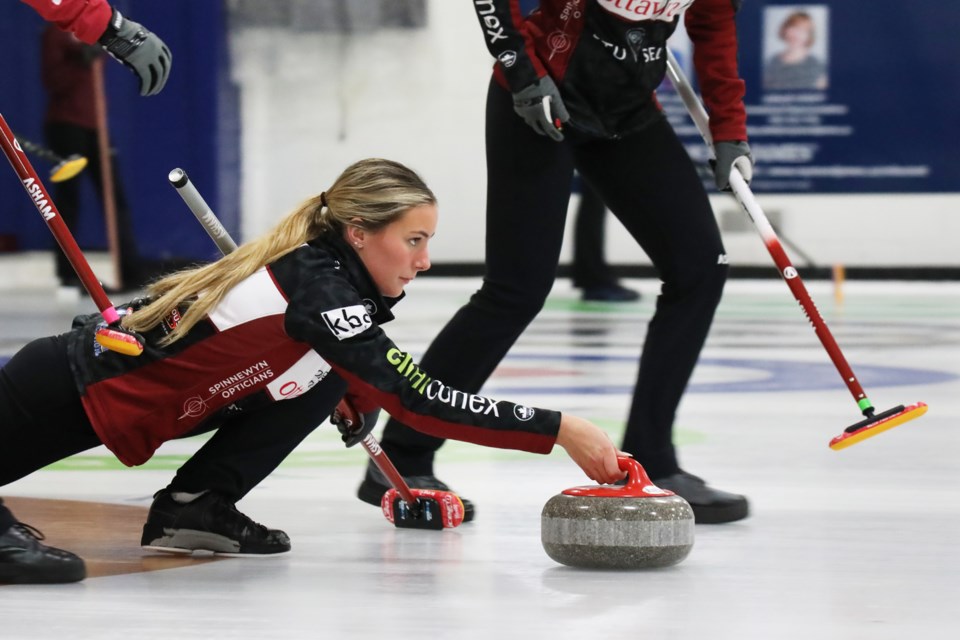 A member of the Rideau Curling Club during the finals of the Stu Sells U18 and Junior Tankards at the Barrie Curling Club on Monday afternoon. 