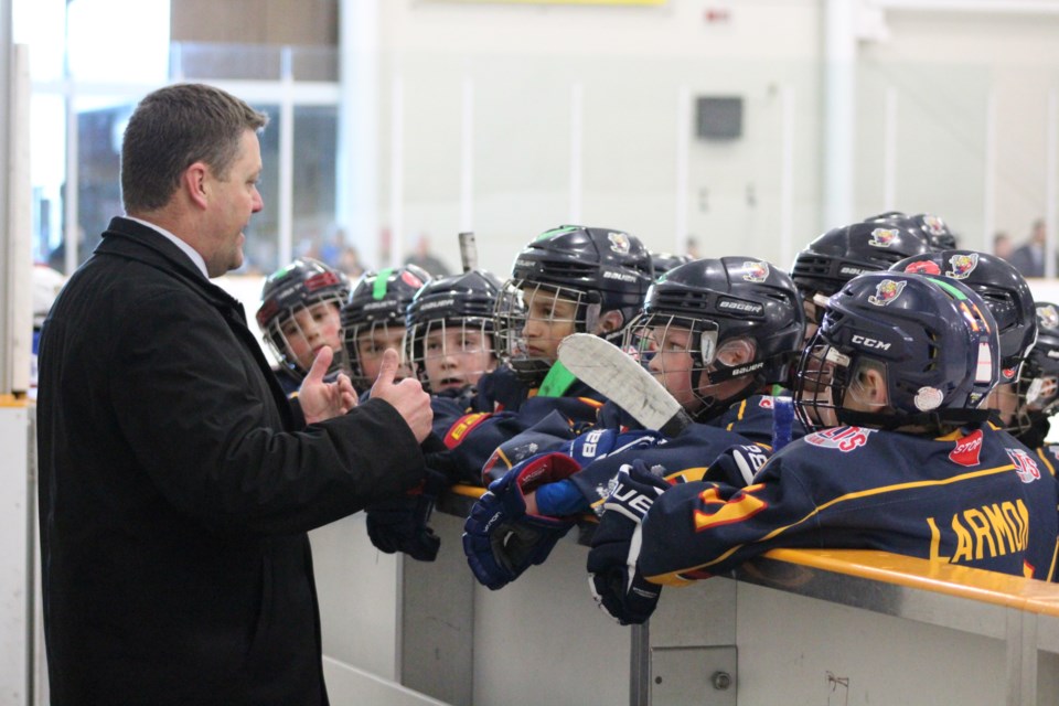 Members of the Barrie Colts atom 'AAA' team listen to instructions from their coach during the OMHA Championship tournament against the Oakville Rangers at Holly Community Centre in Barrie on March 16, 2019. Raymond Bowe/BarrieToday