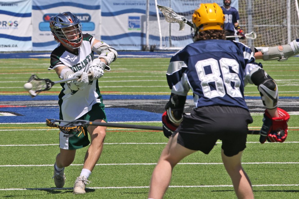 A Patrick Fogarty Flames player takes on the net as the St. Joan of Arc Knights took on their Orillia rivals in the CSASC field lacrosse tournament action at Georgian College's J.C. Massie Field in Barrie on May 7.