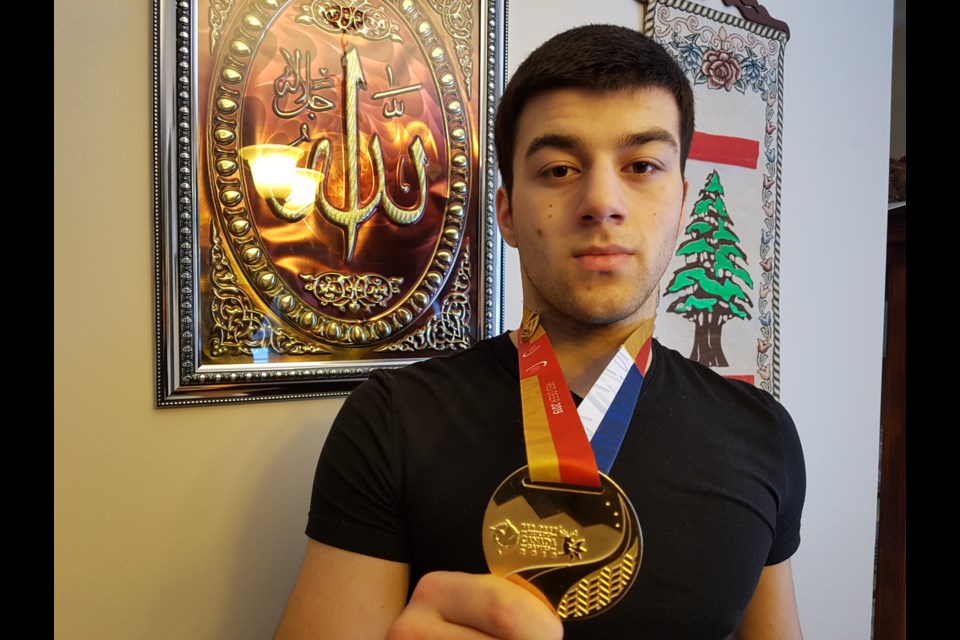 Mohamed Zawadi shows his most recent gold medal. Shawn Gibson/BarrieToday