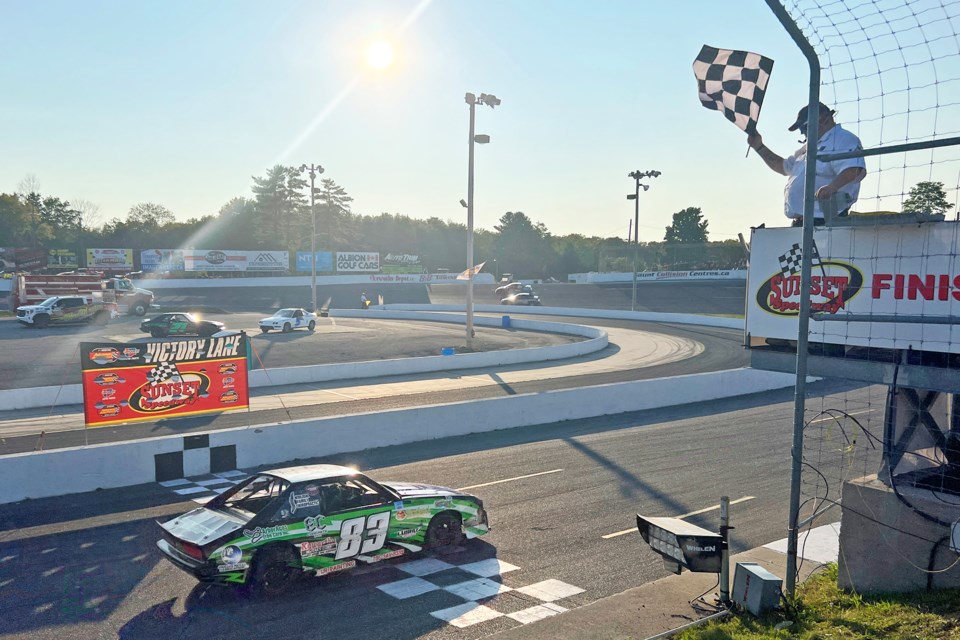 The checkered flag is waved at the end of a race at Sunset Speedway in Innisfil on Saturday night.