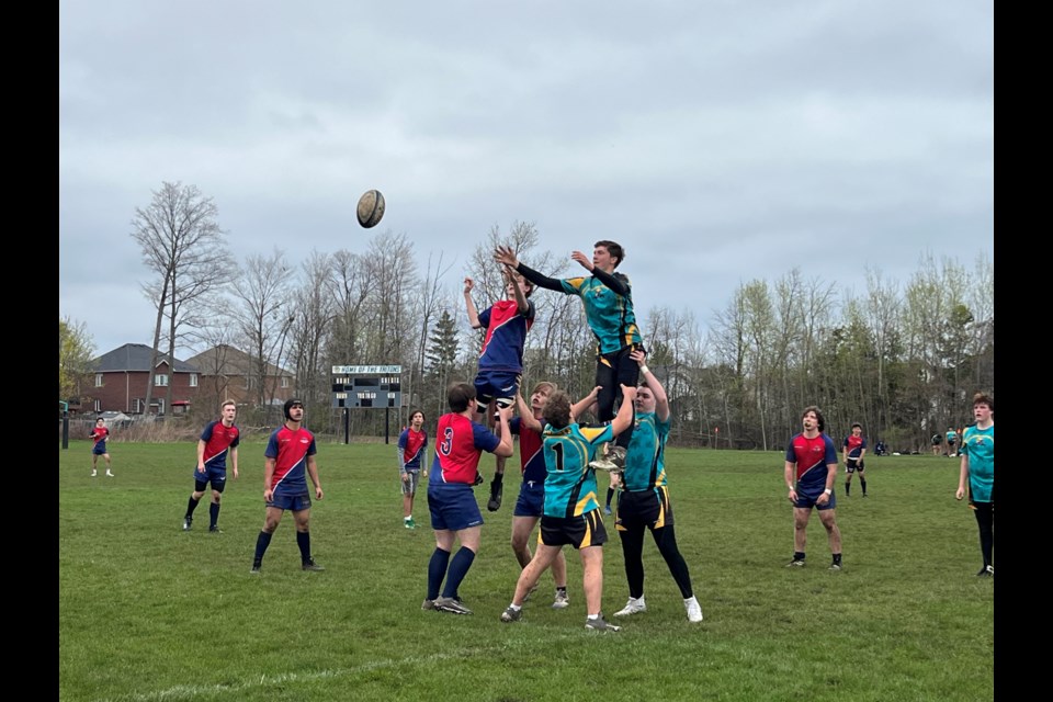 The Bear Creek Kodiaks and Nantyr Shores Tritons battle to a 12-12 tie Monday afternoon in Simcoe County Athletic Association junior boys rugby action in Innisfil.