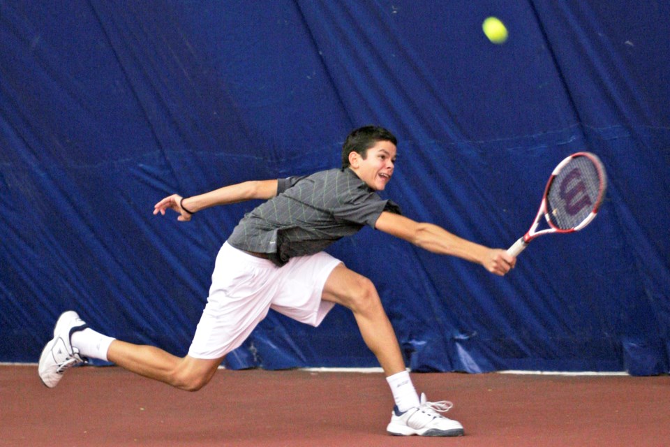Raonic gives it his all as 14-year-old Milos Raonic took on tennis pro Guram Kostava in a charity match in Barrie on Nov. 19, 2005. It was close, with Kostava winning the two sets 6-4 and 7-6.
