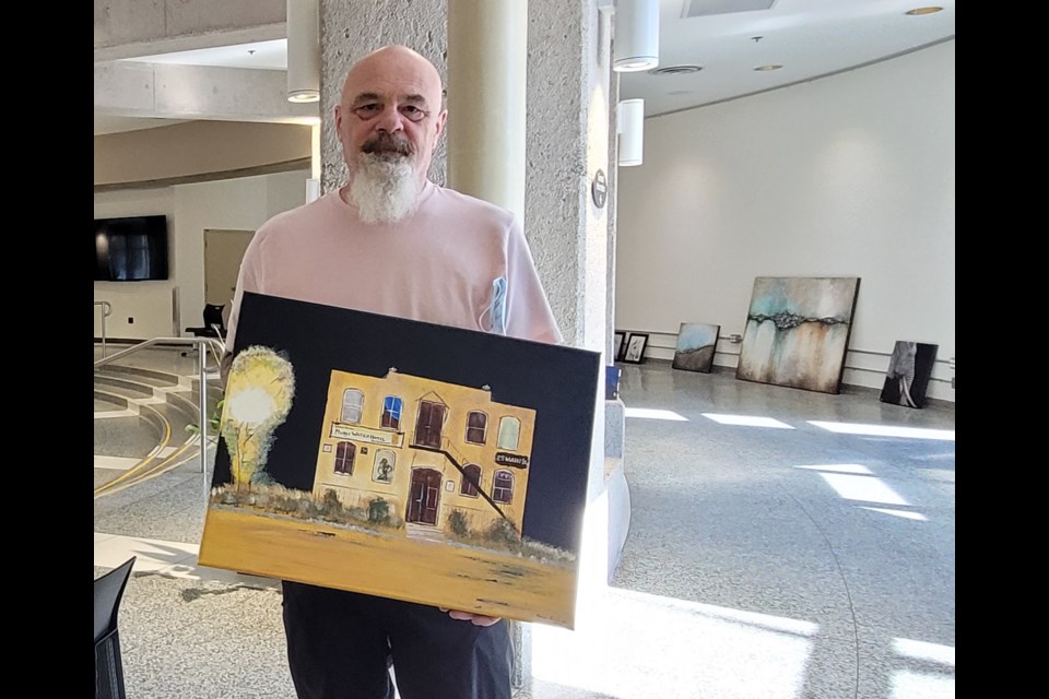 Former military police officer and current Steel Spirit art contributor Brian Lintner, shows off his work, 'The Muddy.' The gallery can be seen at the City Hall rotunda from Oct. 1 to the 27th, Friday, Oct. 1, 2021.