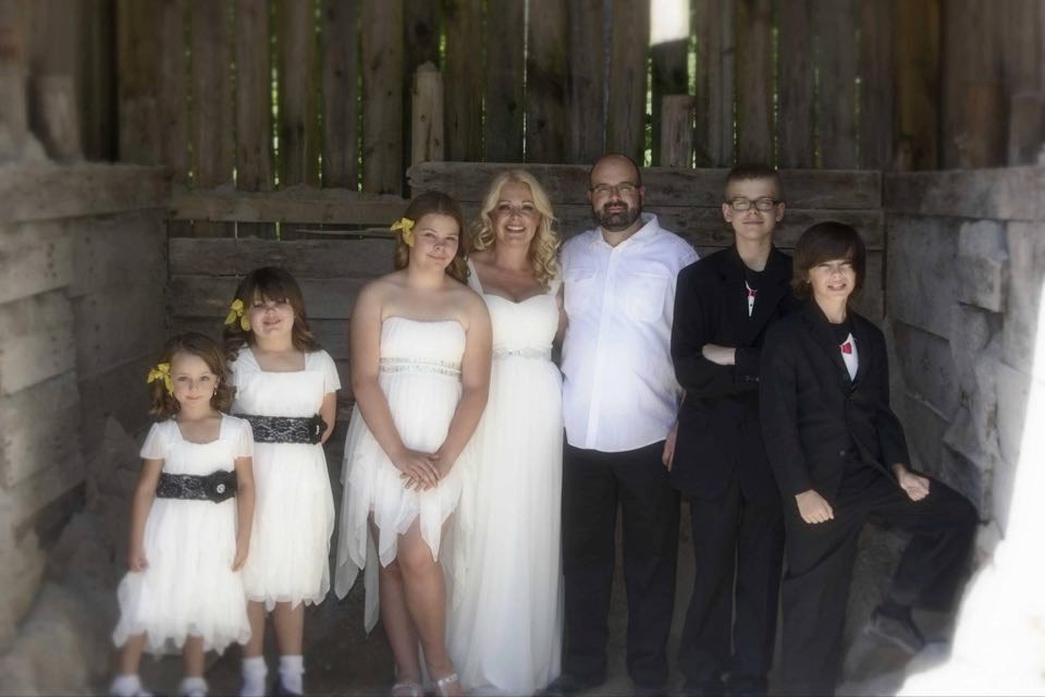 From left, Ashley, Kate, Abby, Aimee, Mike, Luc and Michael make up the family in this 2014 picture of Aimee and Mike's wedding. Photo submitted