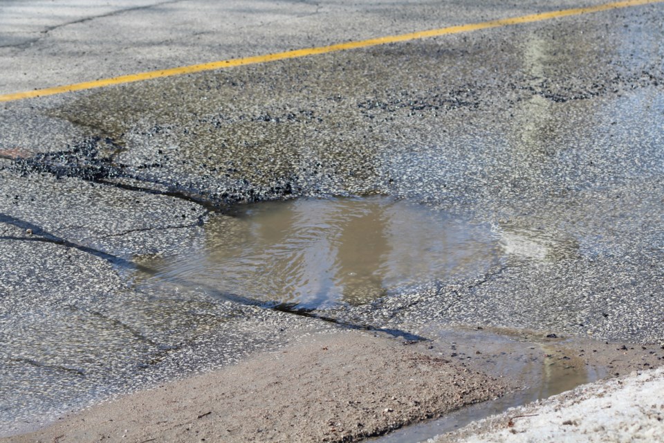 Potholes in Barrie, like this large water-filled one near Ardagh Road and Ferndale Drive, seem to be more prevalent this year. Raymond Bowe/BarrieToday
