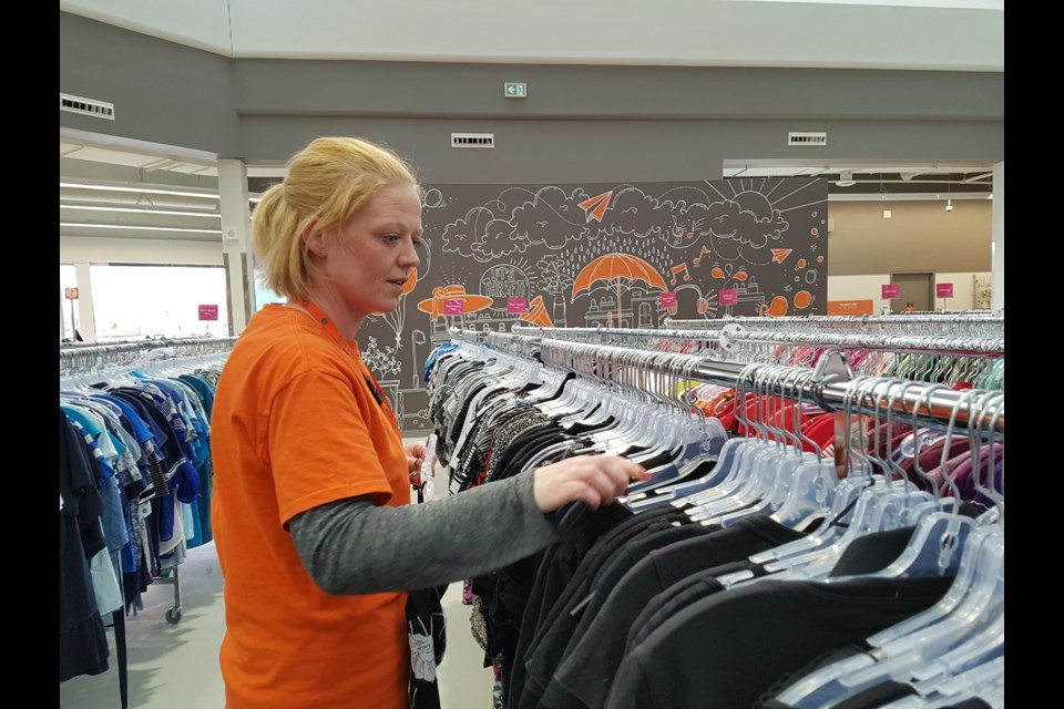 Heather Duffy gets the Talize racks ready for more shoppers on May 14, 2019. Shawn Gibson/BarrieToday