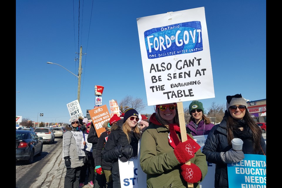 Some creative signs let the Ford government know how protesters felt on Friday. Shawn Gibson/BarrieToday