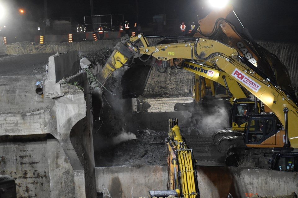 Construction crews work overnight to remove the old Sunnidale Road bridge in Barrie. 