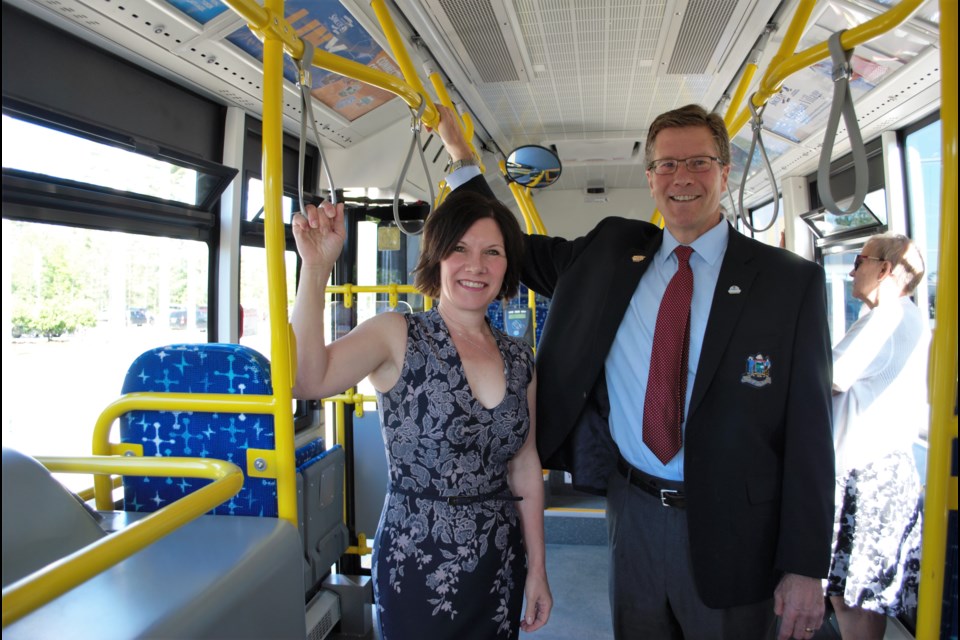 Wasaga Beach Deputy Mayor Nina Bifolchi and Collingwood Deputy Mayor Brian Saunderson test out one of the new transit buses on Tuesday. Jessica Owen/Barrie Today