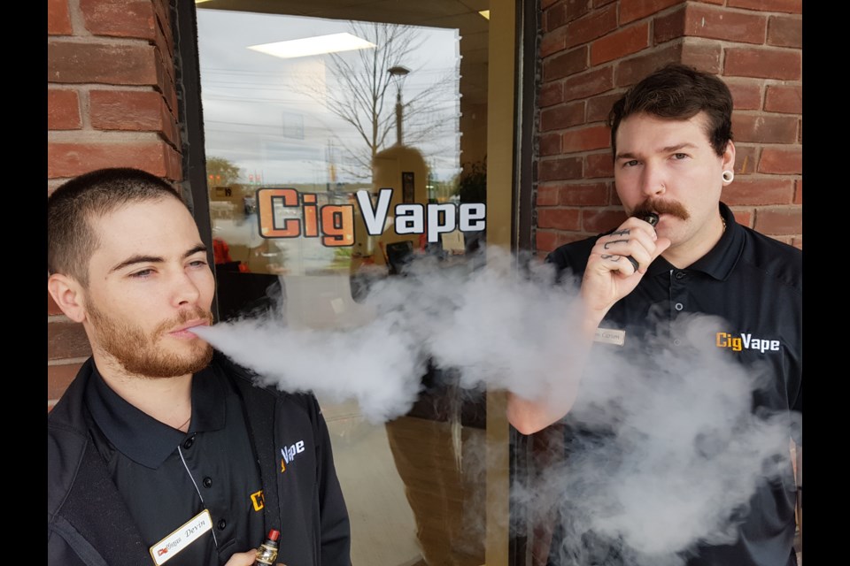 Devin Buckley, left, and Carson Macneall take a break from their jobs at CigVape. Shawn Gibson/BarrieToday