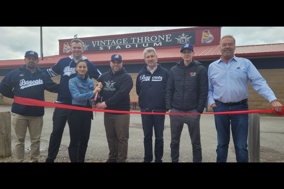Owner of Vintage Throne Barber Lounge Sabrina Di Tommaso (third from left) gets ready to cut the ribbon to her company's new stadium sponsorship. 