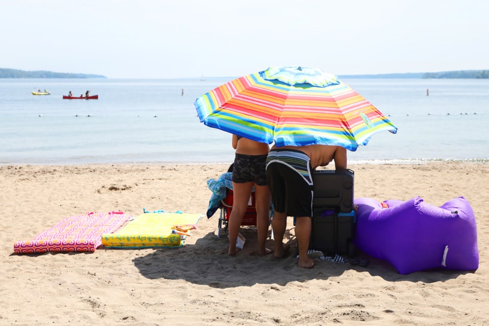 Shade on Centennial Beach was hard to come by during the scorching heat on Sunday, June 17, 2018. Kevin Lamb for BarrieToday