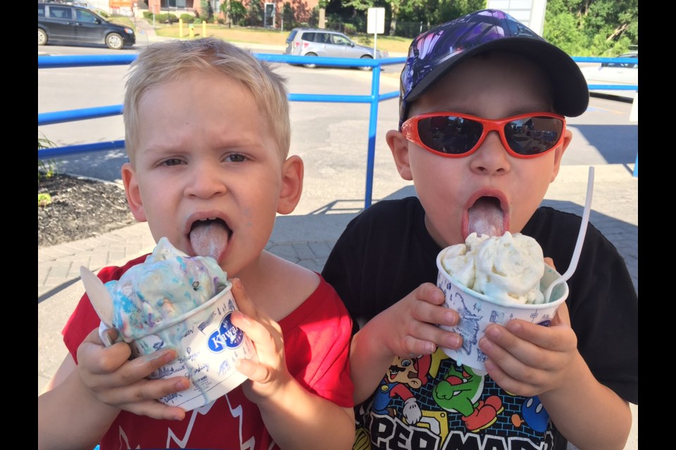 Who needs spoons? Evan Dennis, 3 and his brother Marshall, 6. tuck into some birthday cake ice cream.  Sue Sgambati/BarrieToday