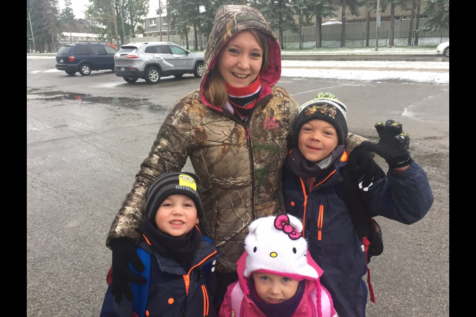 "I love winter.  I Love the snow.  I woke up and I was really excited and so were the kids...I might go home and decorate.  Snow really gets you in the mood," said mom of three Mindy Ross as she walked her kids to school.
Sue Sgambati/BarrieToday