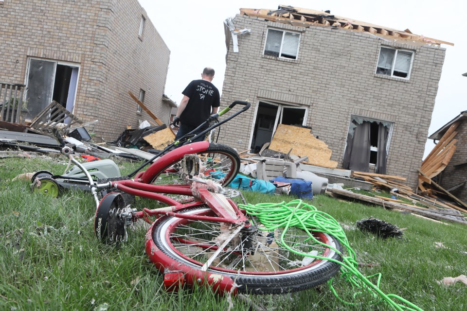 Residents of south-end Barrie begin the clean-up after a tornado touched down on July 15, 2021.