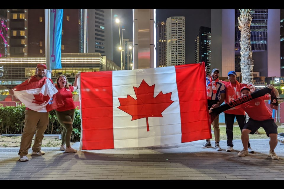 Haily MacDonald (second from left) and friends celebrate Team Canada at the World Cup in Qatar.