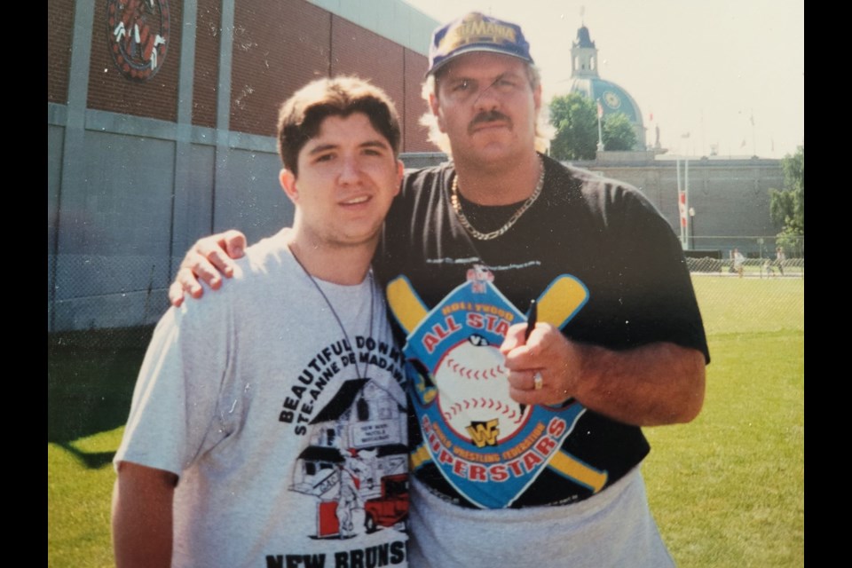 A teenage Shawn Gibson, with dream of being in the wrestling business, is shown with Doc Hendrix (Michael P.S. Hayes) at a WWF/WWE CNE event in the mid-1990s. 