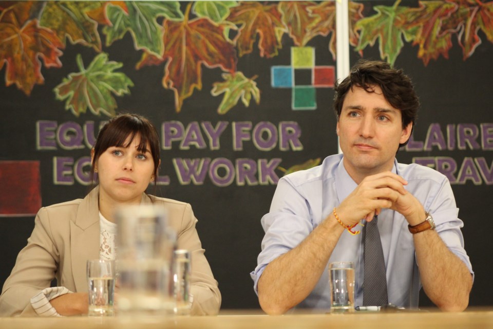 Prime Minister Justin Trudeau and Georgian College tourism student Danielle Berezowsky listen to a question during a roundtable discussion at Barrie's Georgian College campus on Friday. Raymond Bowe/Barrie Today