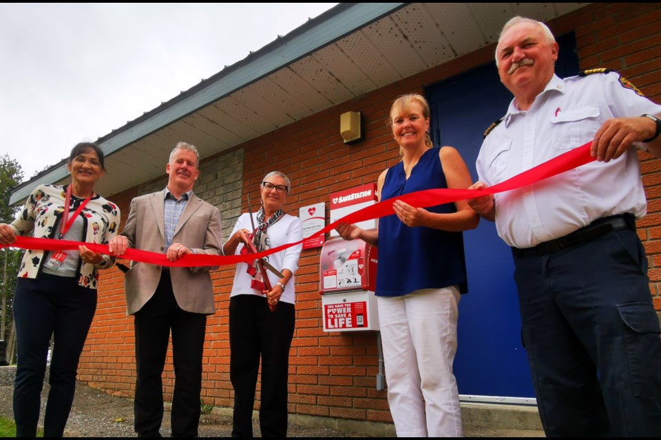 Oro-Medonte Township unveiled SaveStation units in five community parks on Thursday morning. Cutting the ribbon are, from left, Deb VanNatter from Action First Aid, Oro-Medonte Mayor Randy Greenlaw, Patricia Jermey and Deb Hennig from Action First Aid, and Oro-Medonte Fire Chief Hugh Murray.