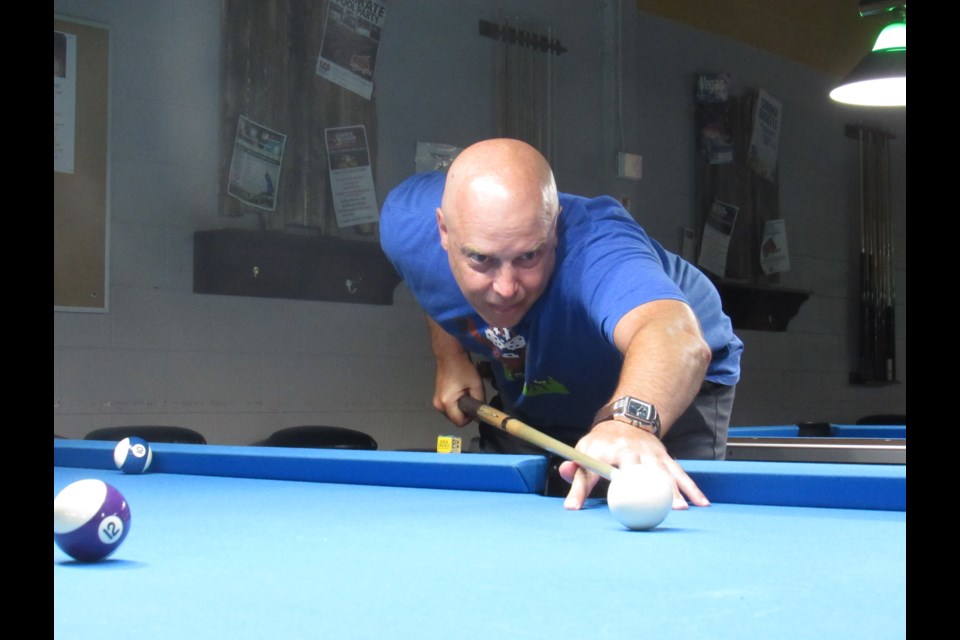 Craig Misener takes a shot at Alliance Billiards to get ready for the fall pool season. Shawn Gibson for BarrieToday                               