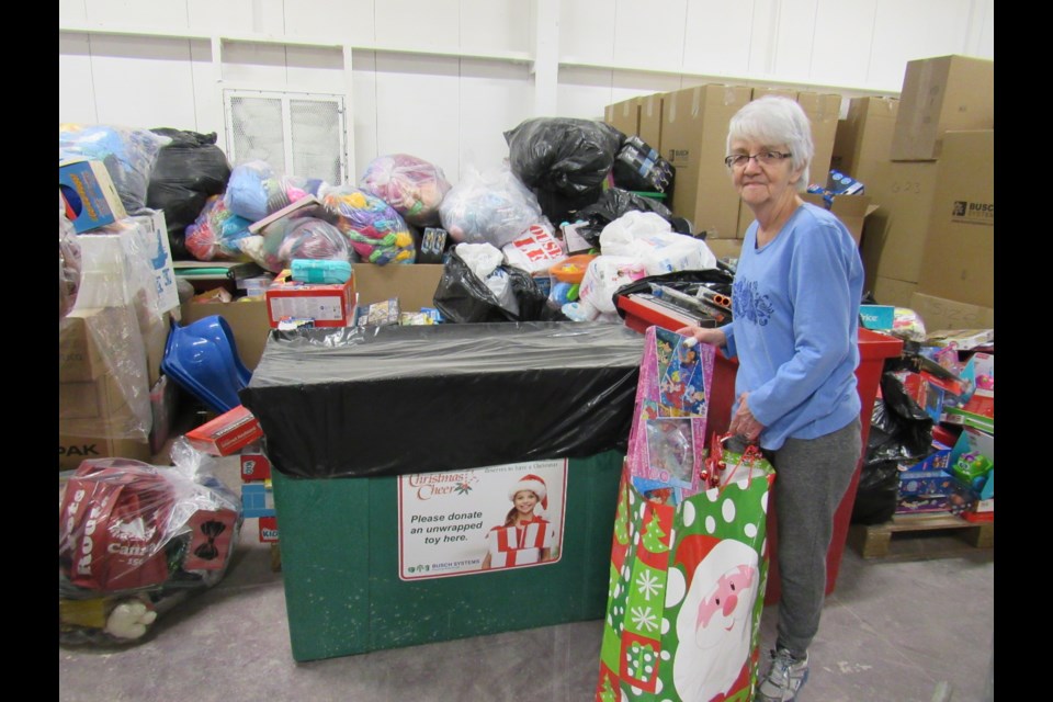 Valerie Blaker sorts toys received by Barrie and District Christmas Cheer. Shawn Gibson for BarrieToday                   
