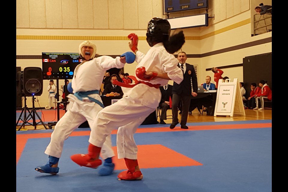 Joanne Rajnandhini (left) fights back for the point in her karate match against Anushka Jawkar, Friday, Feb. 28, 2020. Shawn Gibson/BarrieToday