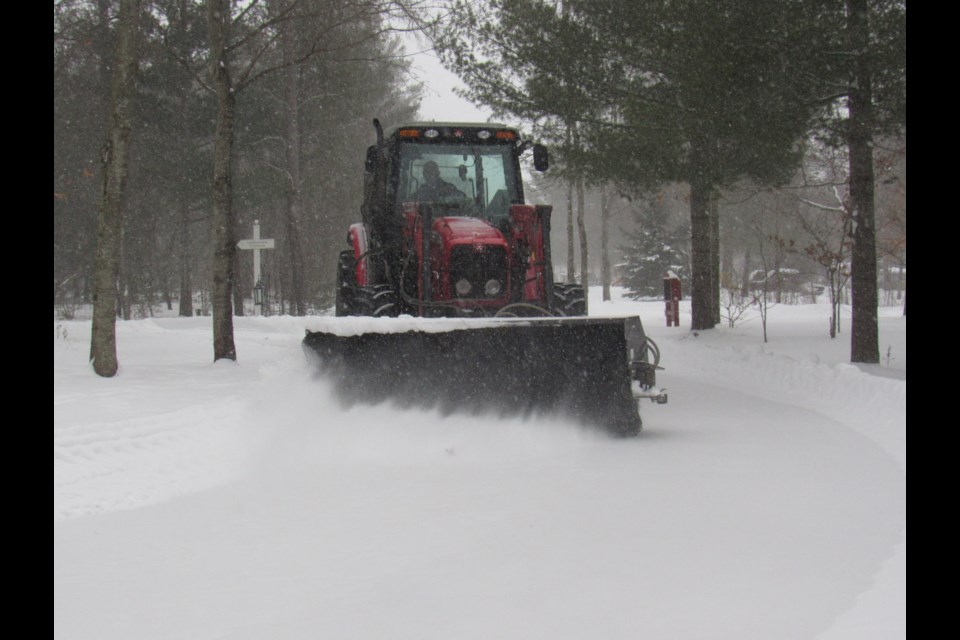 The tractor-plow gets the trail cleared off for anyone looking to brave the weather on Saturday Jan. 18, 2010. Shawn Gibson/BarrieToday                            