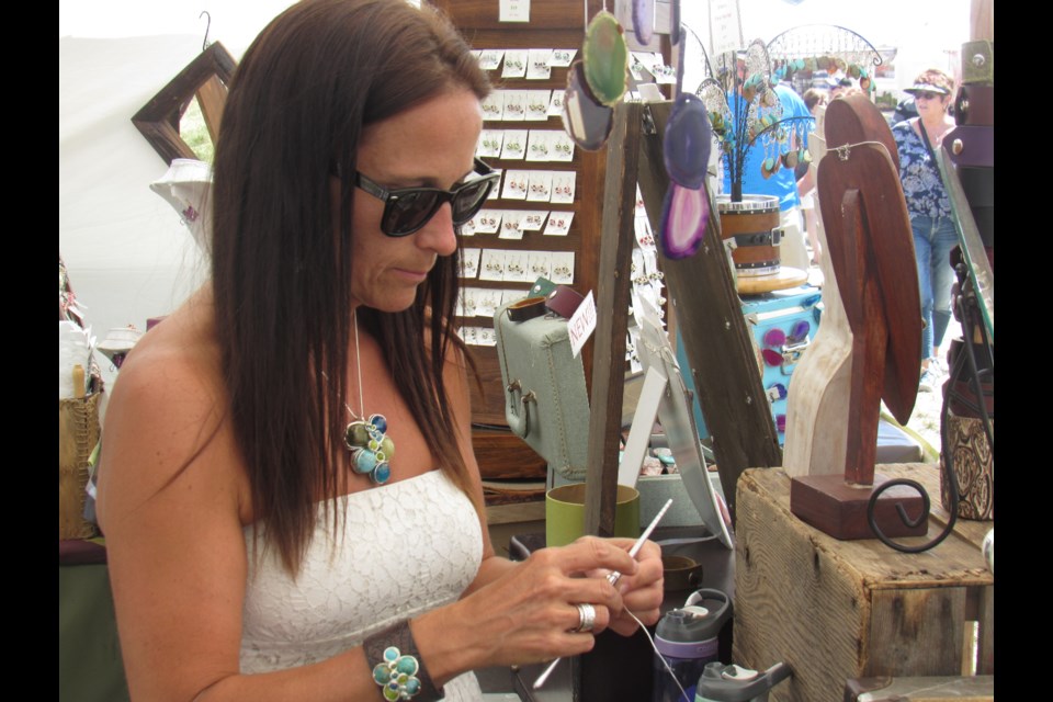 Jen McKee works on one of the many bracelets she and her sister Karen sell at Jeelee Joolery. Shawn Gibson/BarrieToday                           